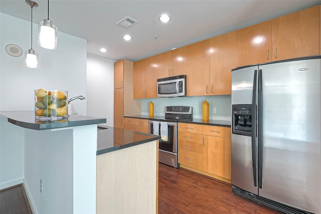 5925 Almeda Rd Unit 11608, Houston, TX 77004 - kitchen featuring stainless steel appliances, dark countertops, dark wood-type flooring, tasteful backsplash, and recessed lighting