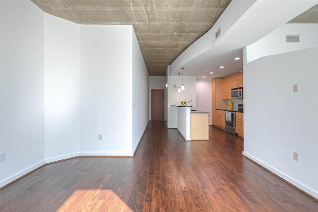 5925 Almeda Rd Unit 11608, Houston, TX 77004 - unfurnished living room with dark wood-style flooring and recessed lighting
