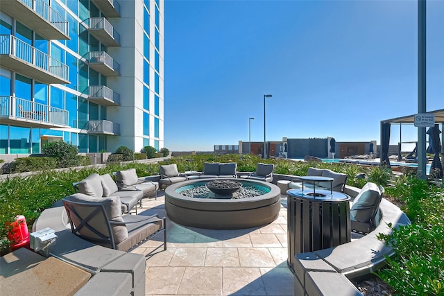 5925 Almeda Rd Unit 11608, Houston, TX 77004 - view of patio with an outdoor living space with a fire pit