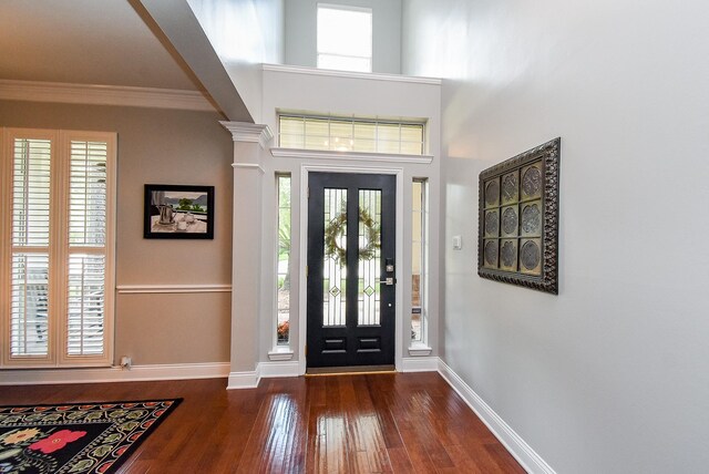 14023 Armant Place Dr, Cypress, TX 77429 - foyer entrance with dark wood-style floors, healthy amount of natural light, and crown molding
