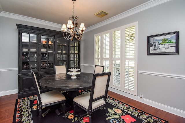 14023 Armant Place Dr, Cypress, TX 77429 - dining space featuring crown molding, a chandelier, and wood finished floors