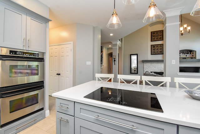 14023 Armant Place Dr, Cypress, TX 77429 - kitchen featuring double oven, gray cabinets, black electric stovetop, light countertops, and light tile patterned floors
