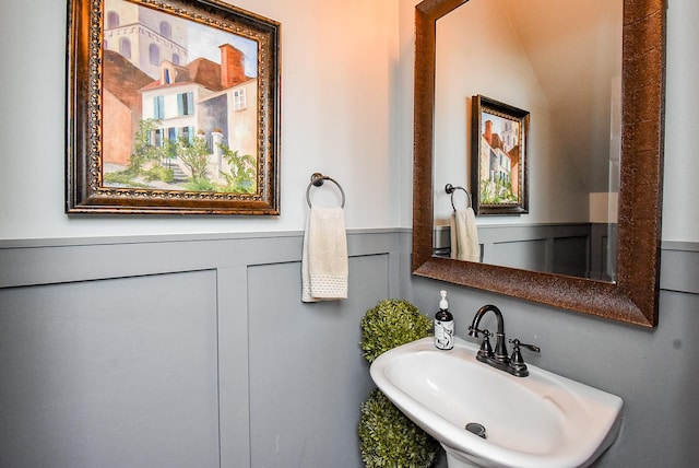 14023 Armant Place Dr, Cypress, TX 77429 - bathroom featuring a wainscoted wall, lofted ceiling, and a decorative wall