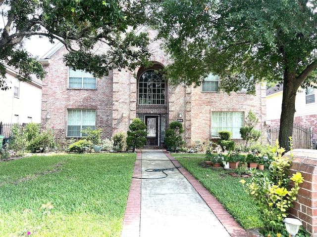 13518 Oak Bend Forest Dr, Houston, TX 77083 - view of front of house with a front yard and brick siding