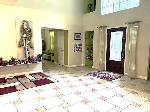 13518 Oak Bend Forest Dr, Houston, TX 77083 - entryway featuring a towering ceiling and baseboards
