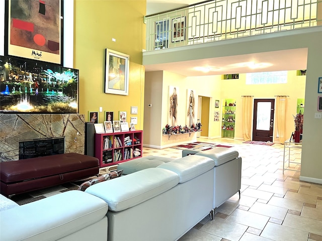 13518 Oak Bend Forest Dr, Houston, TX 77083 - living area featuring a towering ceiling and a fireplace