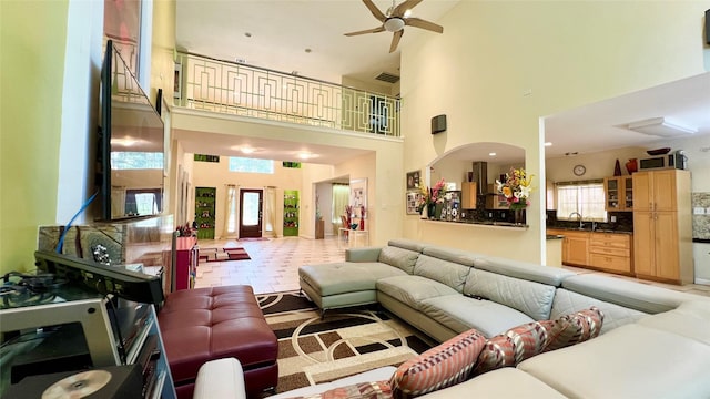 13518 Oak Bend Forest Dr, Houston, TX 77083 - living room featuring a towering ceiling, ceiling fan, and plenty of natural light