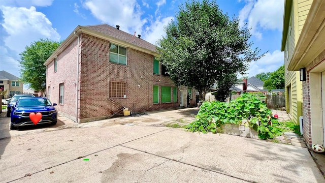 13518 Oak Bend Forest Dr, Houston, TX 77083 - exterior space featuring brick siding and a patio