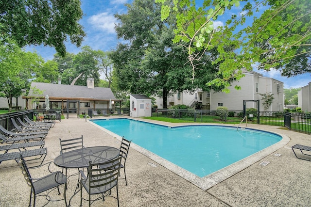 9809 Richmond Ave Unit B13, Houston, TX 77042 - community pool with a patio and a shed