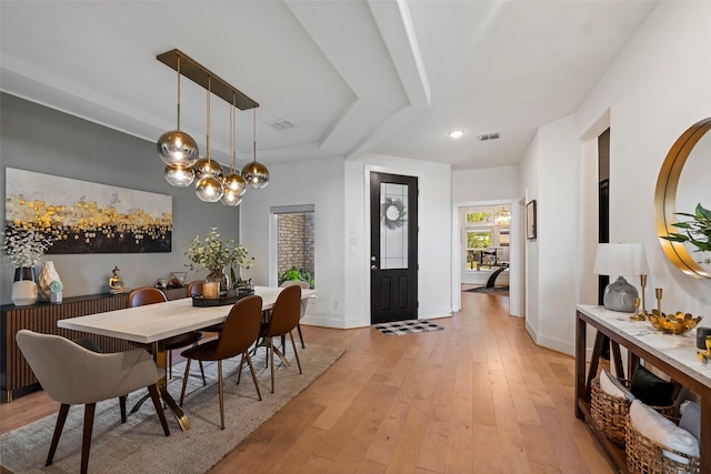18427 Counce Meadow Ct, Cypress, TX 77433 - dining room with light wood-style floors and a chandelier