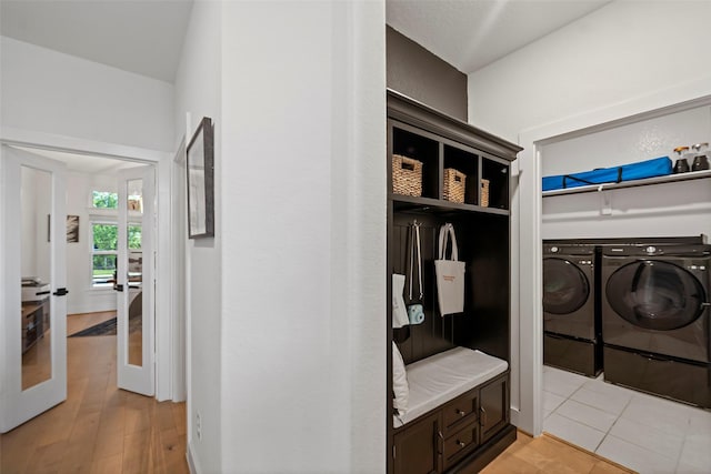 18427 Counce Meadow Ct, Cypress, TX 77433 - mudroom featuring independent washer and dryer, french doors, and light wood finished floors
