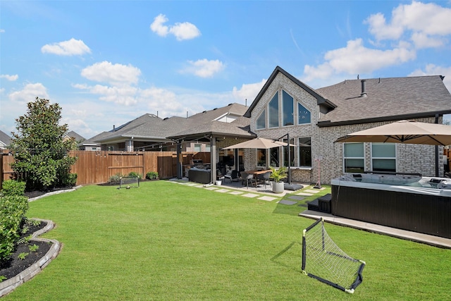 18427 Counce Meadow Ct, Cypress, TX 77433 - rear view of property with a hot tub, a fenced backyard, and a patio area
