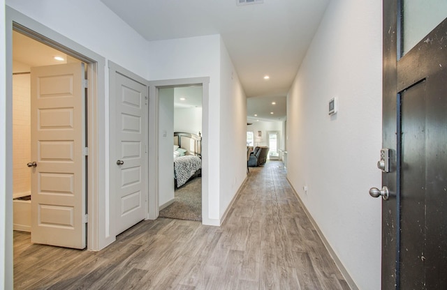 623 Hidden Brook Dr, Baytown, TX 77523 - hallway with light wood-style floors and recessed lighting