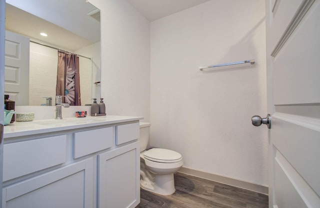 623 Hidden Brook Dr, Baytown, TX 77523 - bathroom with vanity, wood finished floors, curtained shower, and recessed lighting