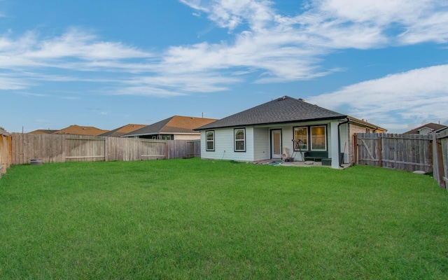 623 Hidden Brook Dr, Baytown, TX 77523 - back of property featuring a fenced backyard and roof with shingles