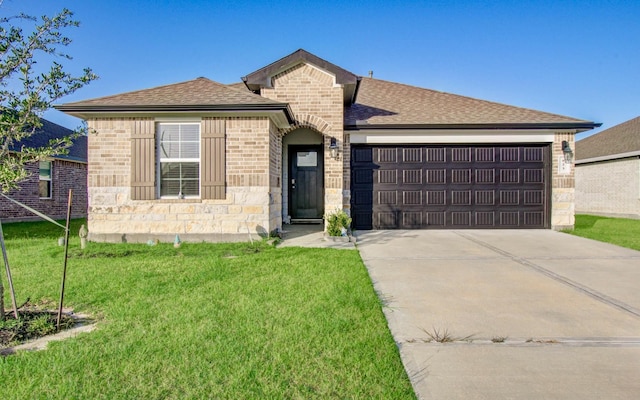 623 Hidden Brook Dr, Baytown, TX 77523 - view of front of home featuring an attached garage, concrete driveway, brick siding, and a front lawn