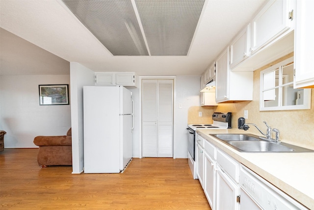 14777 Wunderlich Dr Unit 1103, Houston, TX 77069 - kitchen featuring white appliances, light countertops, light wood finished floors, and white cabinetry