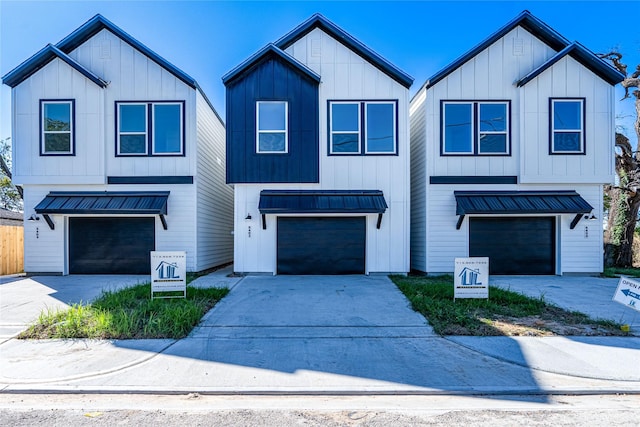 5402 Margarita St, Houston, TX 77020 - modern farmhouse with board and batten siding, an attached garage, and driveway