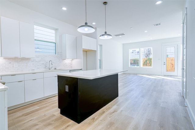 5402 Margarita St, Houston, TX 77020 - kitchen with modern cabinets, white cabinets, tasteful backsplash, healthy amount of natural light, and recessed lighting