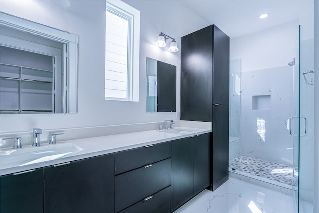 5402 Margarita St, Houston, TX 77020 - bathroom featuring a marble finish shower, double vanity, and marble finish floors