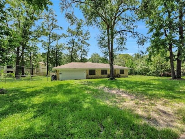 602 Devereaux St, Diboll, TX 75941 - view of yard with a garage