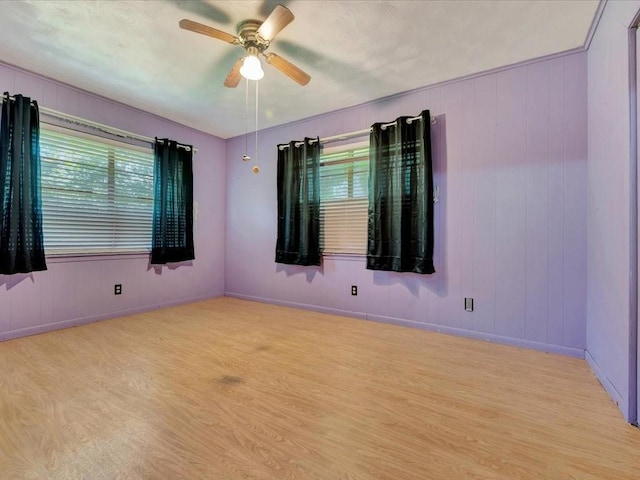 602 Devereaux St, Diboll, TX 75941 - spare room featuring light wood-style flooring, plenty of natural light, and a ceiling fan