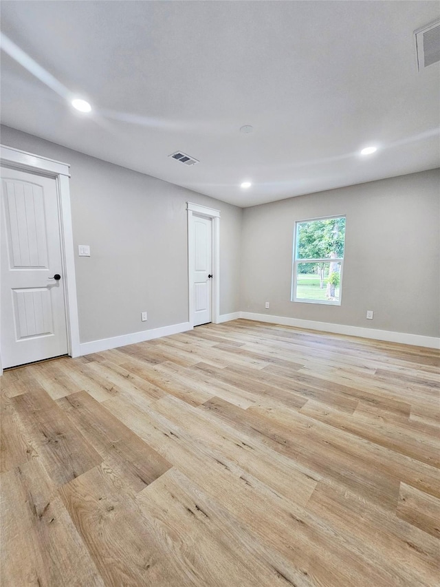 5014 Middleton St, Baytown, TX 77520 - empty room featuring light wood finished floors and recessed lighting