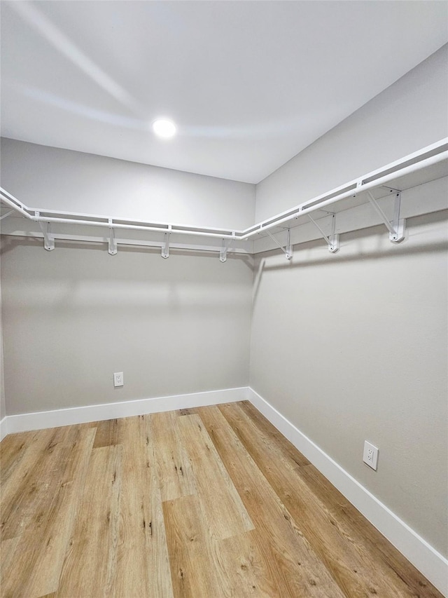 5014 Middleton St, Baytown, TX 77520 - walk in closet featuring wood finished floors