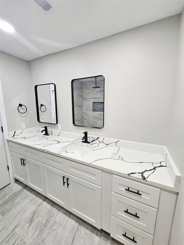 5014 Middleton St, Baytown, TX 77520 - bathroom featuring double vanity and a tile shower