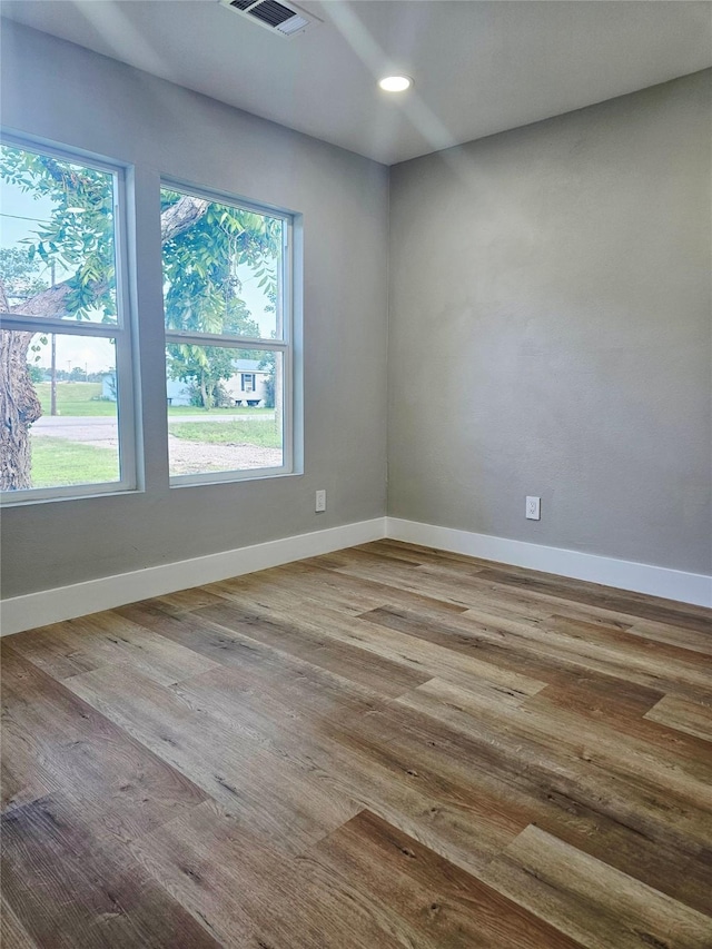5014 Middleton St, Baytown, TX 77520 - spare room featuring wood finished floors and recessed lighting