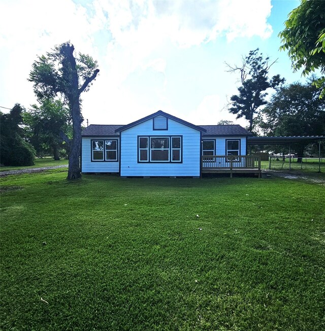 5014 Middleton St, Baytown, TX 77520 - view of front facade with a front yard and a deck