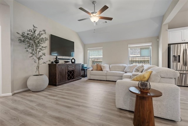4607 Primrose Valley Ln, Fulshear, TX 77441 - living room with vaulted ceiling, ceiling fan, and light wood-style flooring