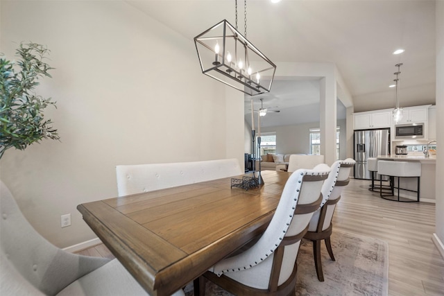 4607 Primrose Valley Ln, Fulshear, TX 77441 - dining room with light wood-style floors, recessed lighting, a ceiling fan, and a chandelier