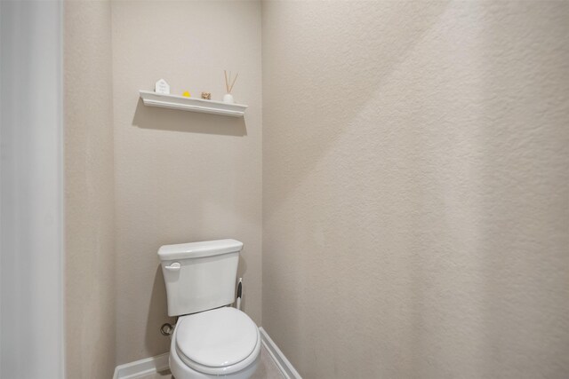 4607 Primrose Valley Ln, Fulshear, TX 77441 - bathroom featuring toilet and baseboards
