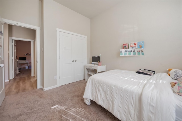 4607 Primrose Valley Ln, Fulshear, TX 77441 - bedroom featuring carpet floors, a closet, and lofted ceiling
