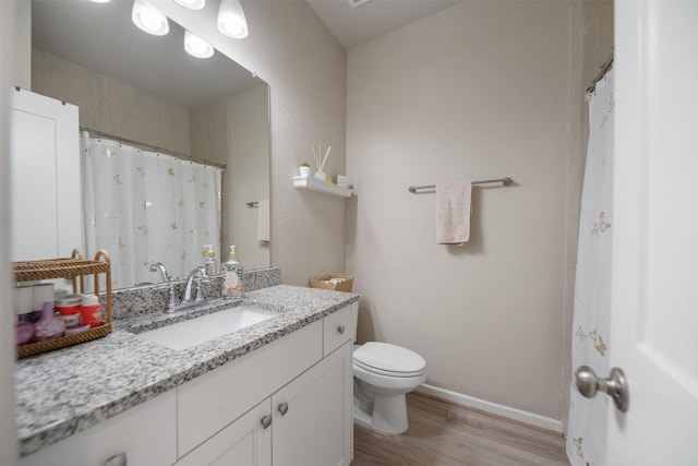 4607 Primrose Valley Ln, Fulshear, TX 77441 - bathroom with wood finished floors and vanity