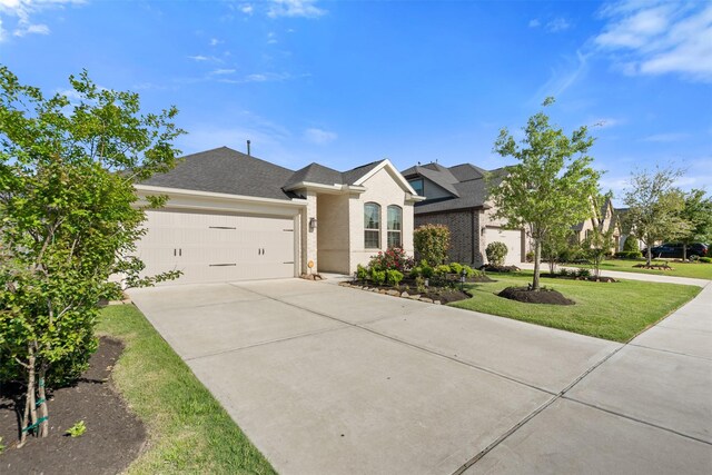4607 Primrose Valley Ln, Fulshear, TX 77441 - ranch-style home with an attached garage, concrete driveway, a front lawn, and brick siding