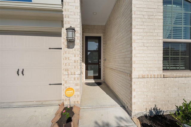 4607 Primrose Valley Ln, Fulshear, TX 77441 - doorway to property with brick siding and an attached garage