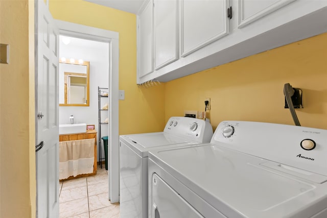 4444 18th St, Bacliff, TX 77518 - washroom with cabinet space, washing machine and clothes dryer, and light marble finish floors