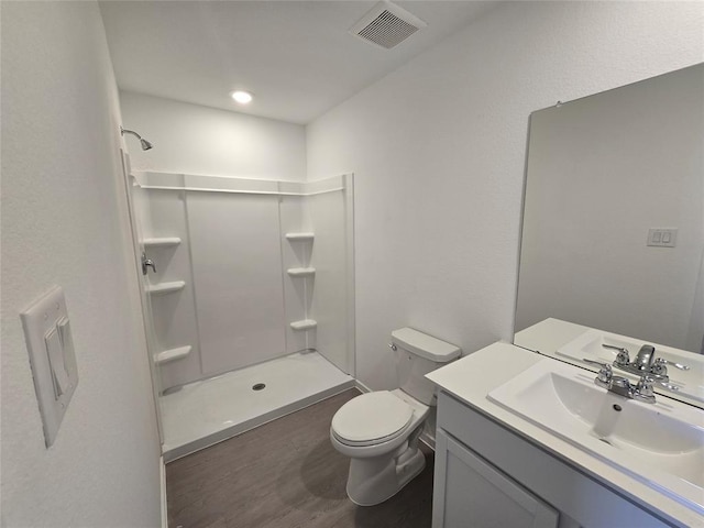 313 Nicholas Rd, Wharton, TX 77488 - full bath with vanity, a shower, and wood finished floors