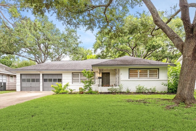 4614 Kinglet St, Houston, TX 77035 - ranch-style home with an attached garage, brick siding, a front lawn, driveway, and a shingled roof