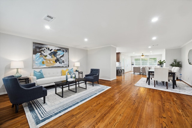 4614 Kinglet St, Houston, TX 77035 - living room with recessed lighting, ornamental molding, wood finished floors, and ceiling fan