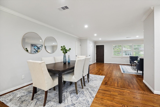 4614 Kinglet St, Houston, TX 77035 - dining room featuring wood finished floors, ornamental molding, and recessed lighting