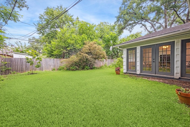 4614 Kinglet St, Houston, TX 77035 - fenced backyard featuring french doors