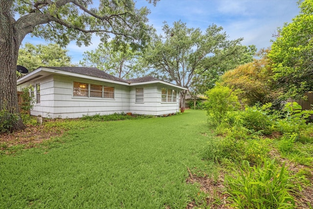 4614 Kinglet St, Houston, TX 77035 - view of property exterior with a lawn