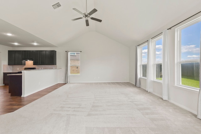 3011 Tandem Ct, Rosenberg, TX 77471 - unfurnished living room featuring light colored carpet, vaulted ceiling, ceiling fan, and recessed lighting