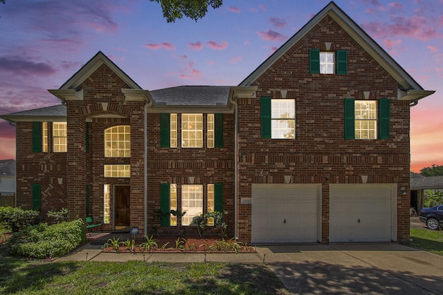 2521 Sea Horse Ct, Seabrook, TX 77586 - view of front of home with driveway, a garage, brick siding, and roof with shingles