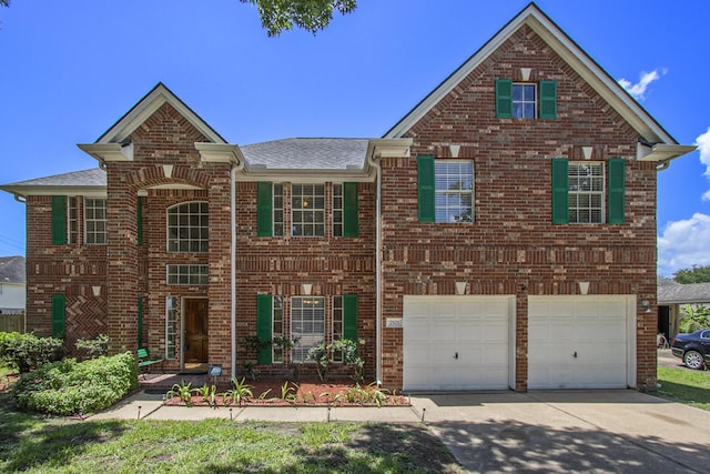 2521 Sea Horse Ct, Seabrook, TX 77586 - view of front of home with brick siding, a garage, concrete driveway, and roof with shingles