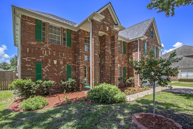 2521 Sea Horse Ct, Seabrook, TX 77586 - traditional home featuring brick siding and a shingled roof