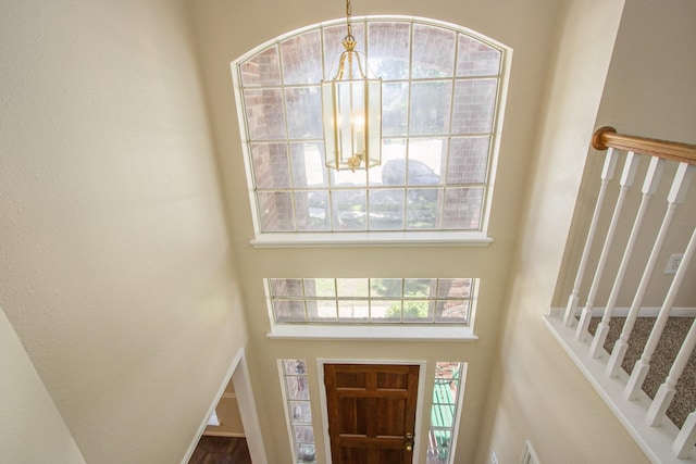 2521 Sea Horse Ct, Seabrook, TX 77586 - entrance foyer with a chandelier, a high ceiling, and stairs